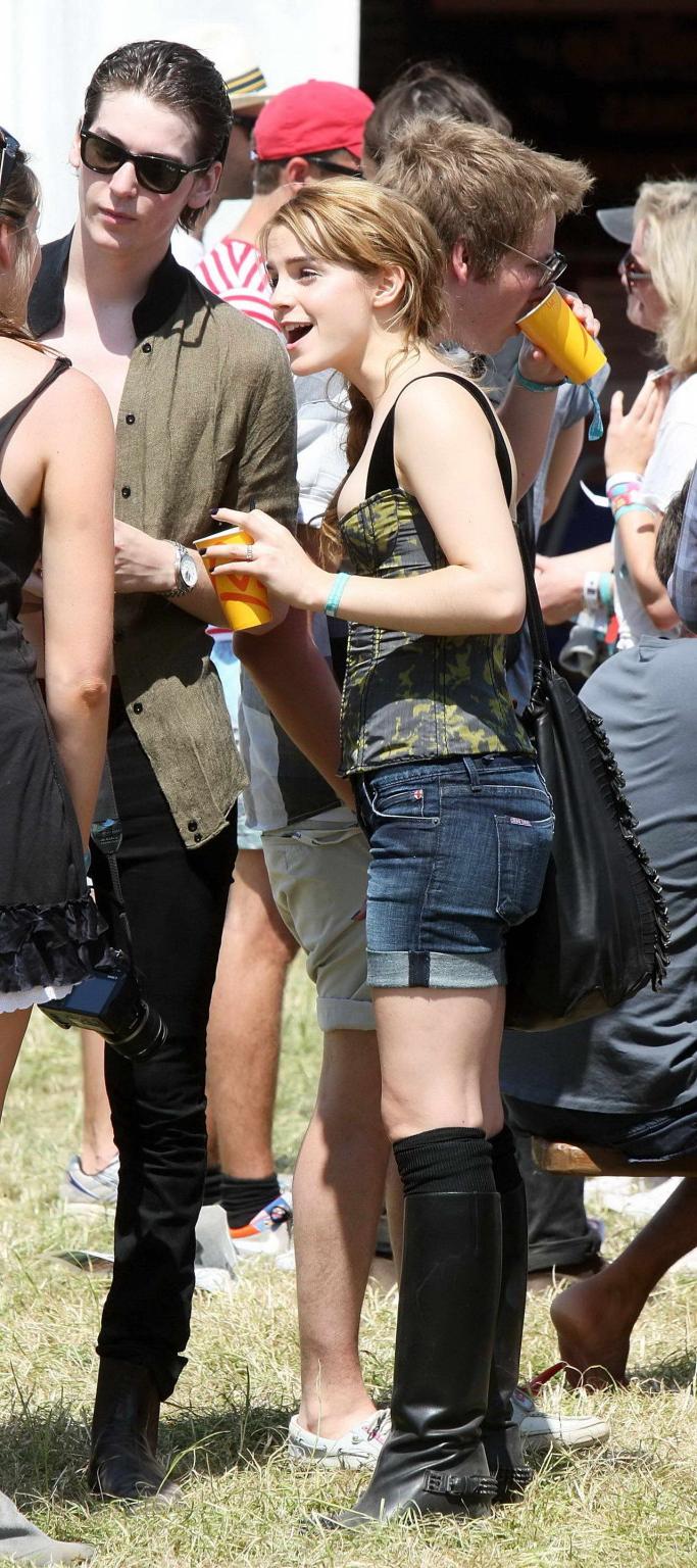 16P Emma Watson leggy  cleavy wearing low cut top, shorts  bots at Glastonbury Music