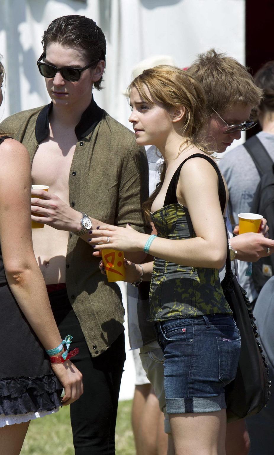 16P Emma Watson leggy  cleavy wearing low cut top, shorts  bots at Glastonbury Music