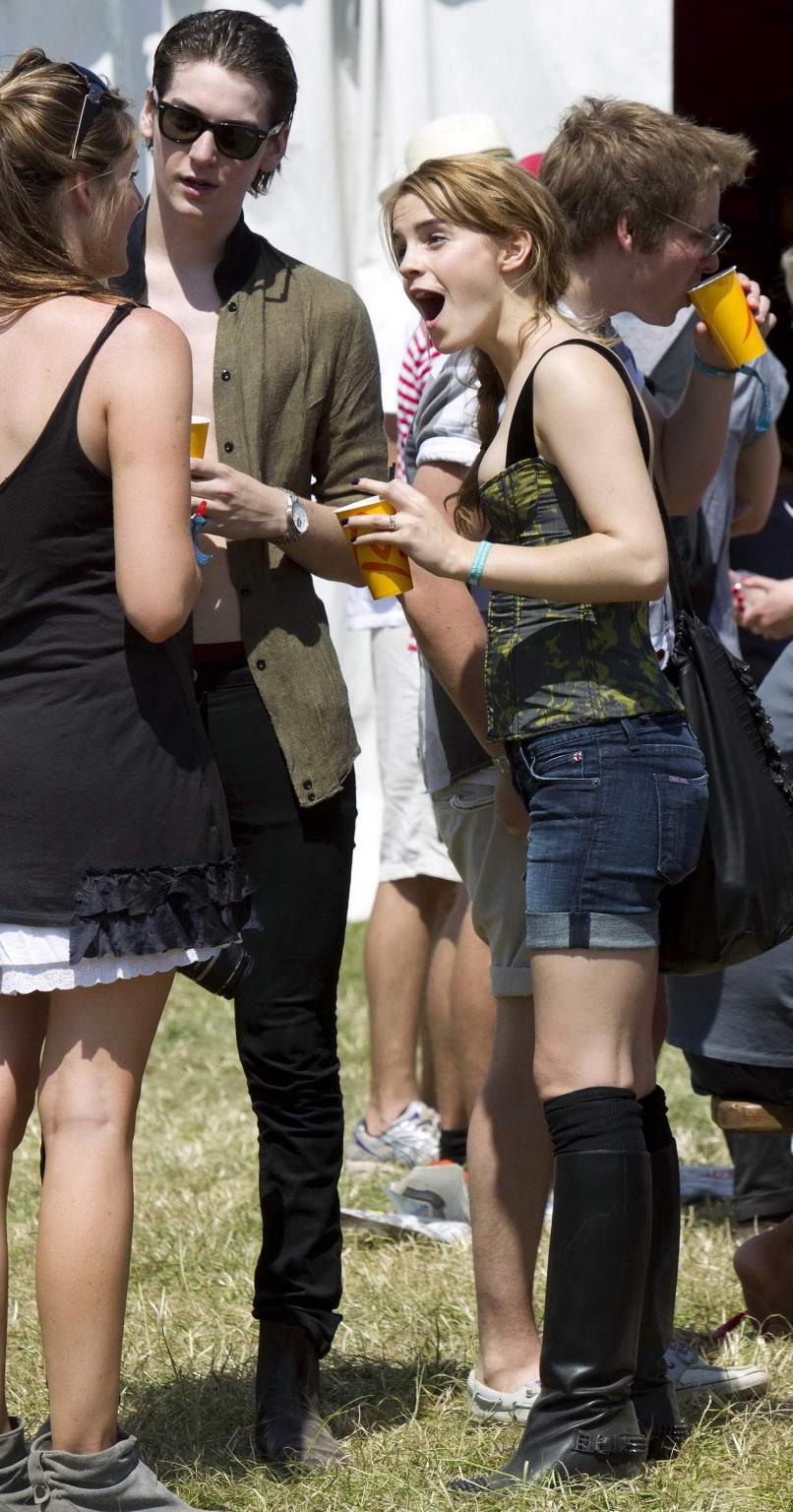 16P Emma Watson leggy  cleavy wearing low cut top, shorts  bots at Glastonbury Music