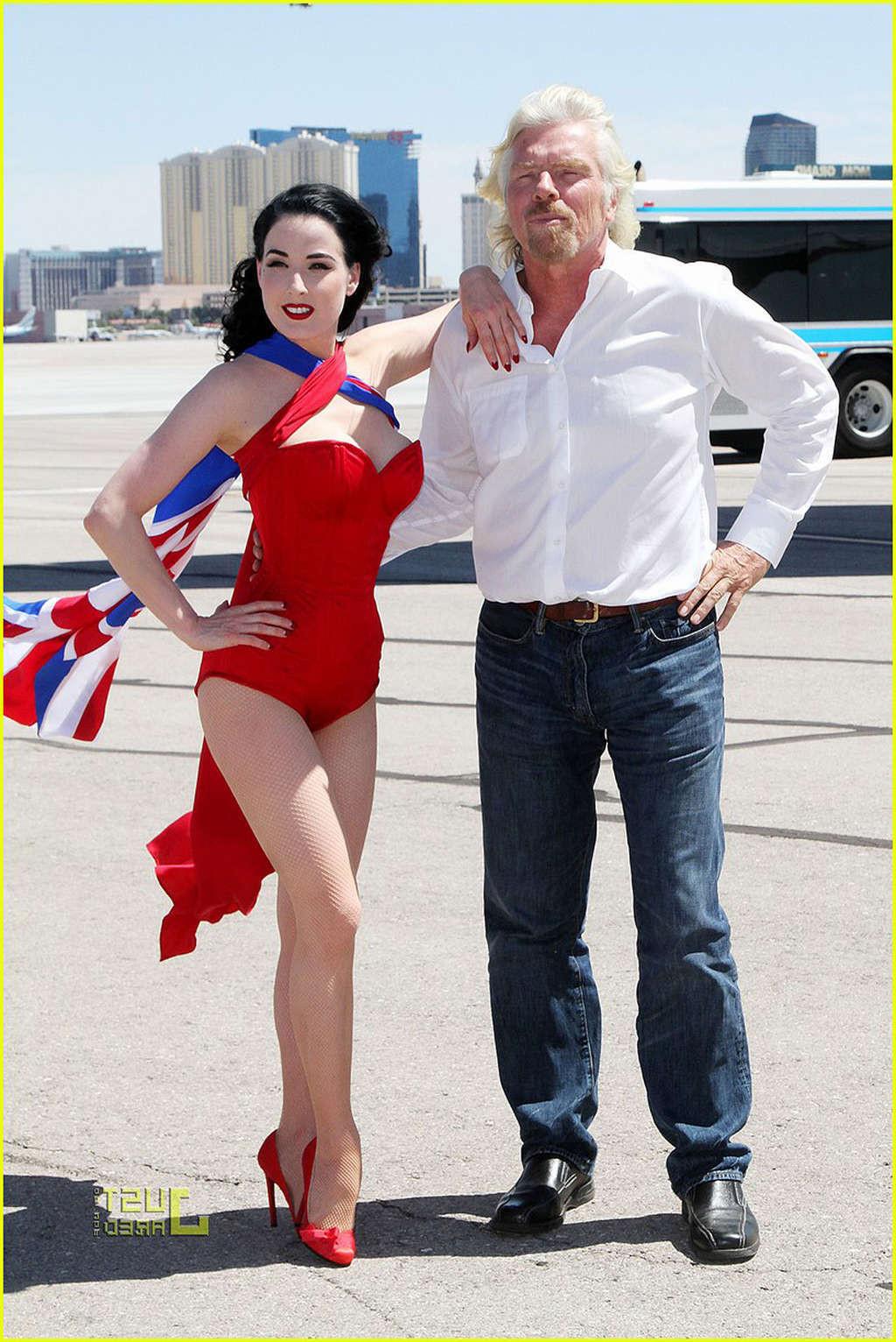 16P Dita Von Teese looking sexy in red outfit and exposing her tits