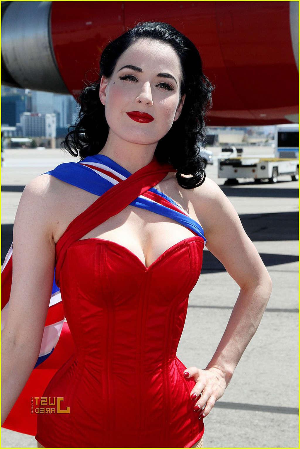 16P Dita Von Teese looking sexy in red outfit and exposing her tits