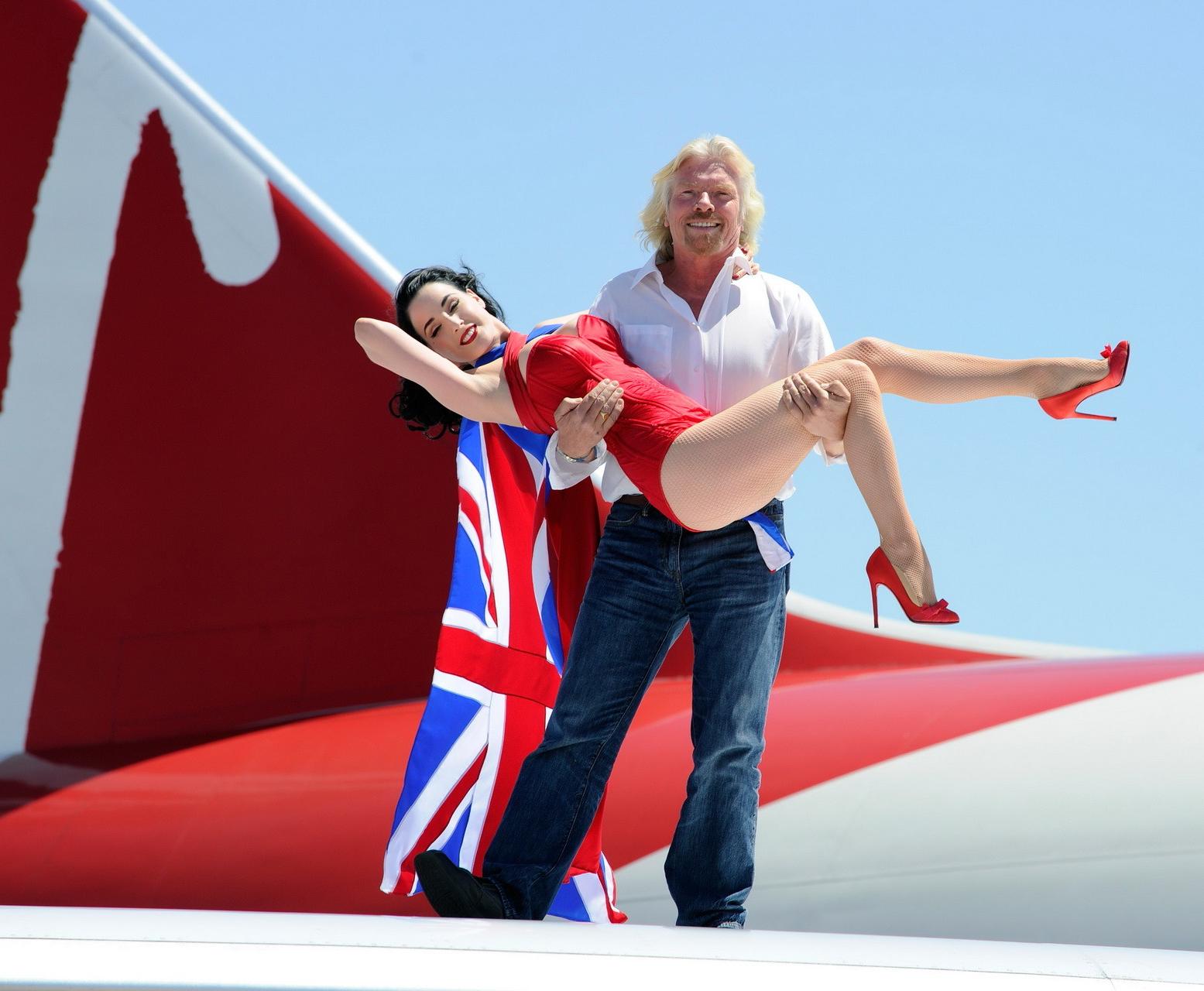 16P Dita Von Teese wearing red corset  fishnets at Virgin Atlantic's celebration