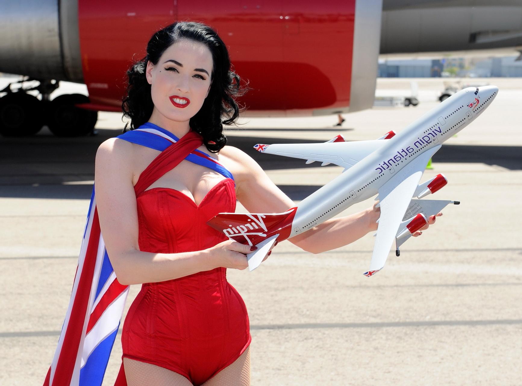 16P Dita Von Teese wearing red corset  fishnets at Virgin Atlantic's celebration