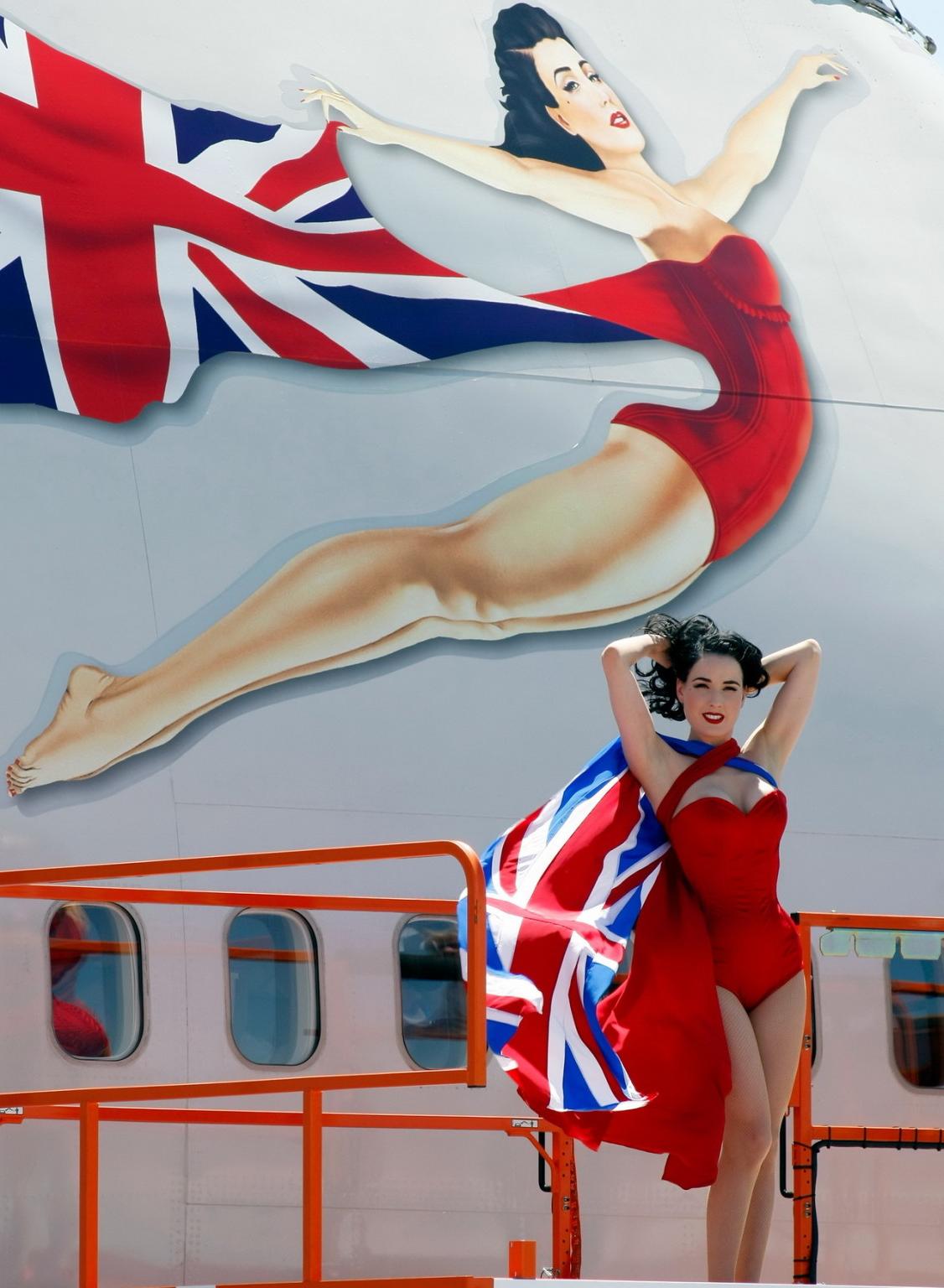 16P Dita Von Teese wearing red corset  fishnets at Virgin Atlantic's celebration