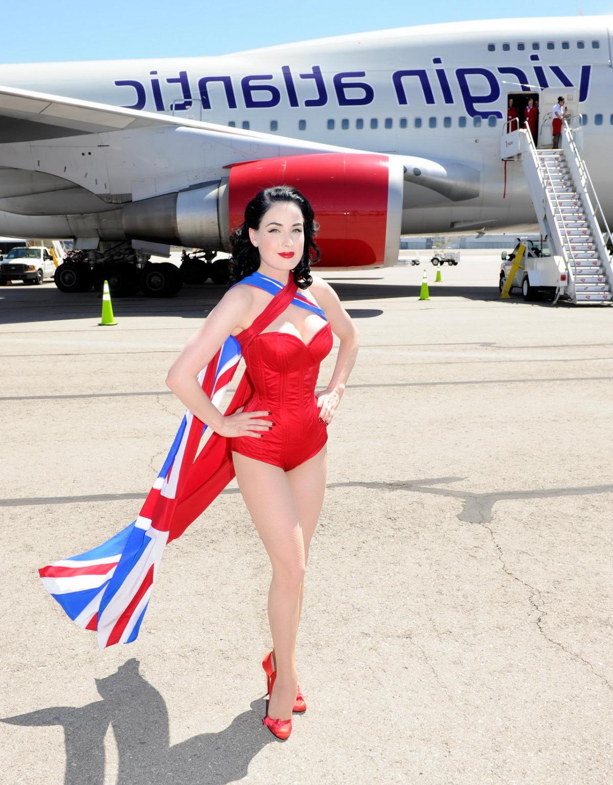 16P Dita Von Teese wearing red corset  fishnets at Virgin Atlantic's celebration