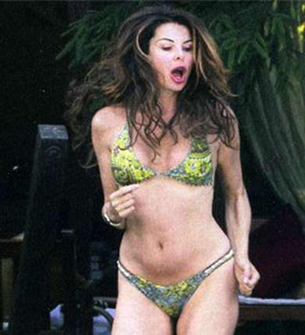 10P Alba Parietti exposing her nice big tits on beach and upskirt paparazzi shoots