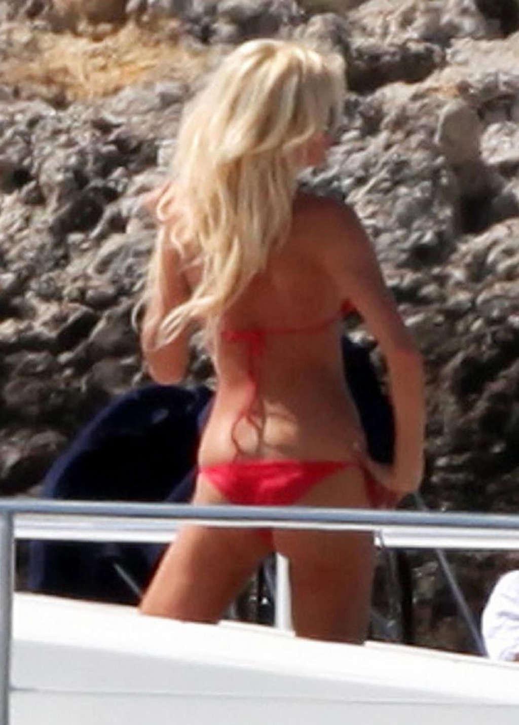 10P Victoria Silvstedt showing her perfect body and great ass in red bikini on beach