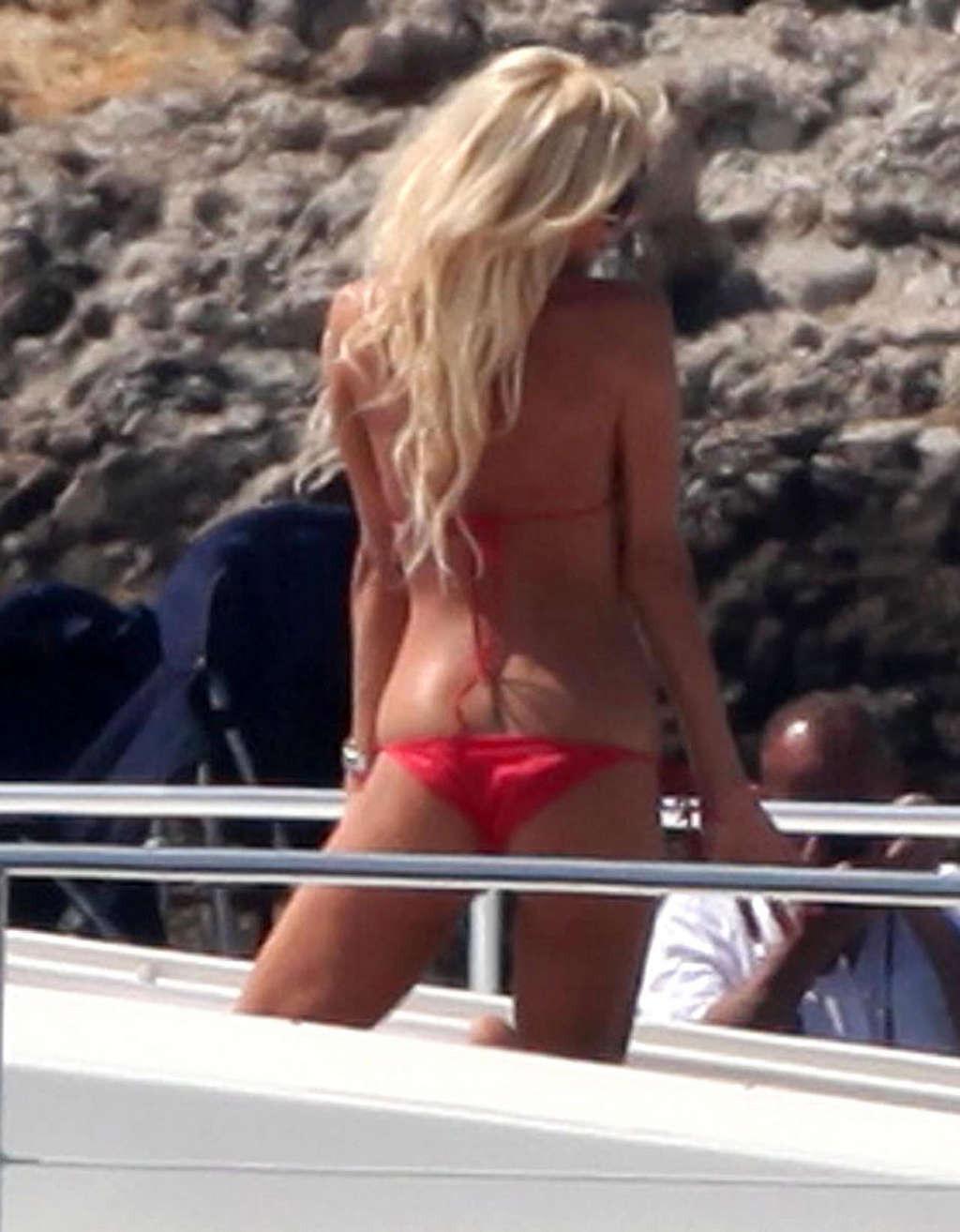 10P Victoria Silvstedt showing her perfect body and great ass in red bikini on beach