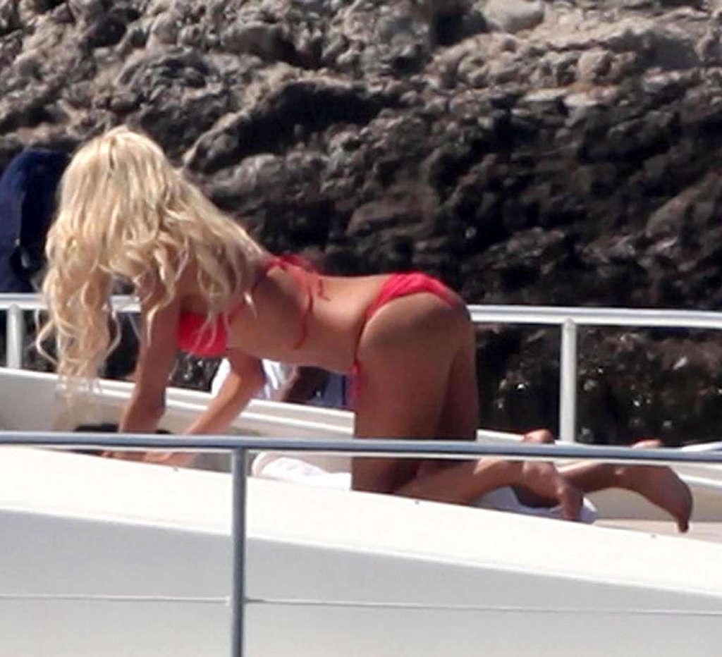 10P Victoria Silvstedt showing her perfect body and great ass in red bikini on beach