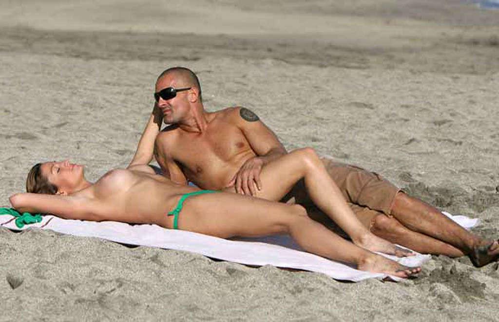 10P Rebecca Loos exposing her nice big tits on beach paparazzi shoots