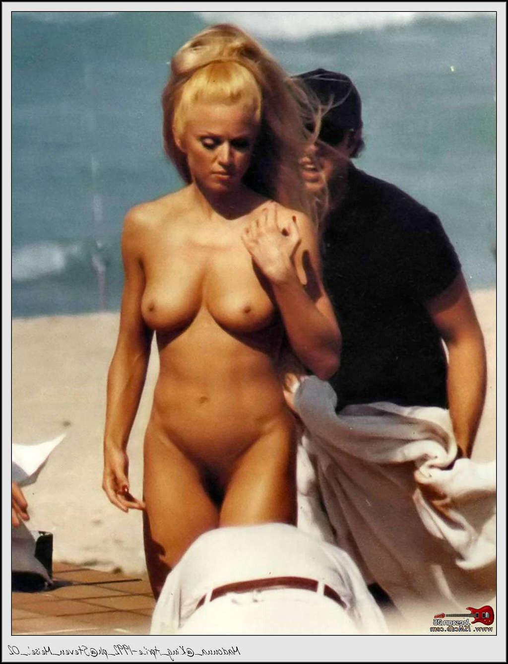 10P Madonna reaveling her nice tits and hairy pussy on beach