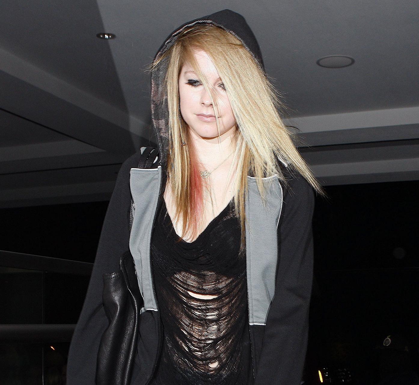 16P Avril Lavigne exposing her sexy body and hot tits in see thru blouse