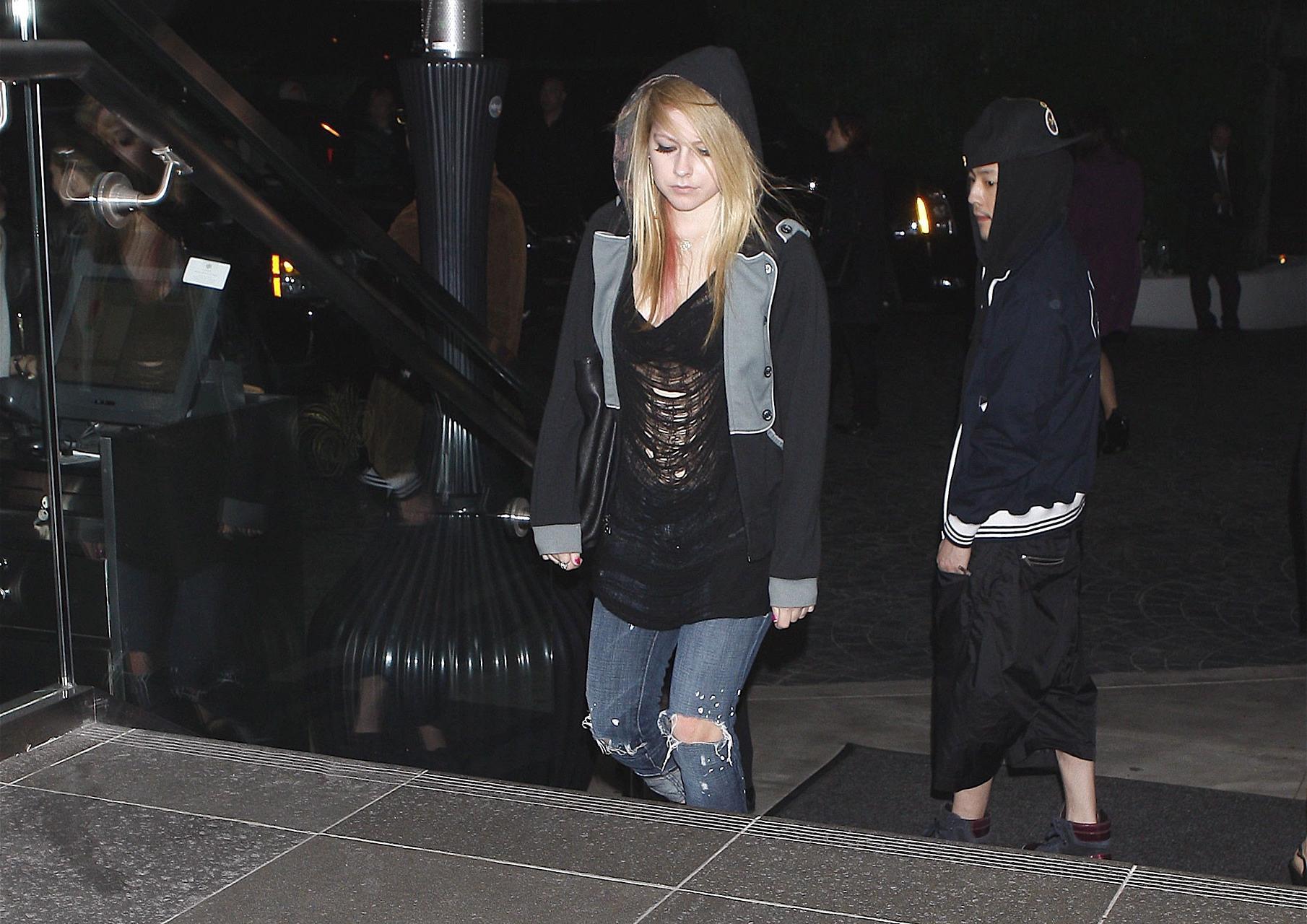 16P Avril Lavigne exposing her sexy body and hot tits in see thru blouse
