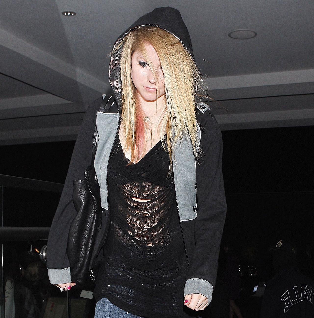16P Avril Lavigne exposing her sexy body and hot tits in see thru blouse