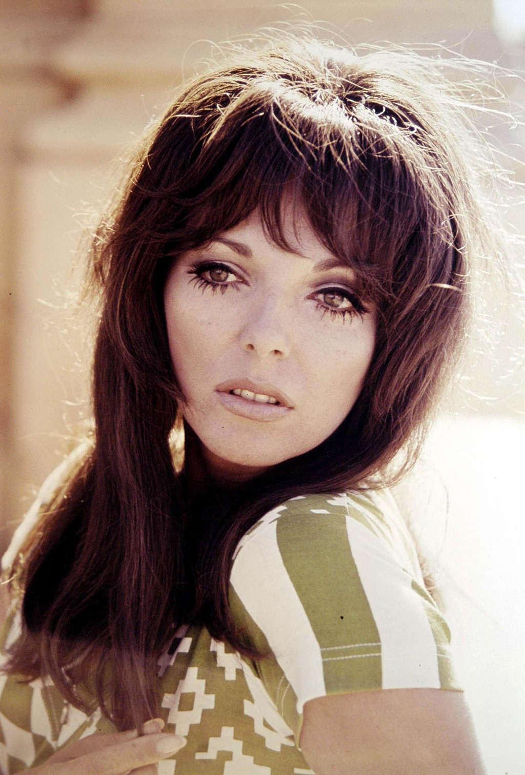 16P Joan Collins exposing her nice big tits in photoshoot