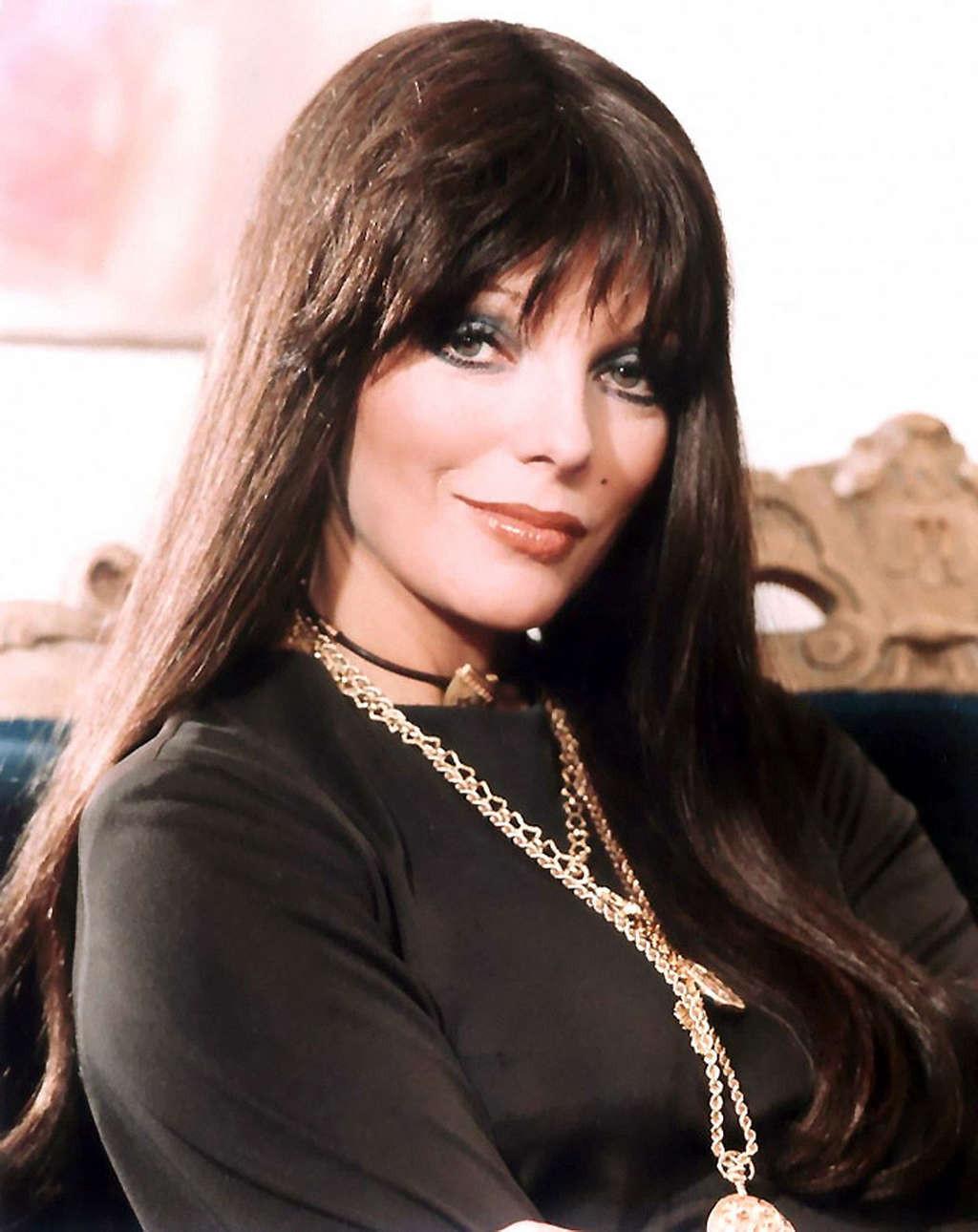 16P Joan Collins exposing her nice big tits in photoshoot