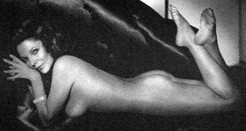 16P Joan Collins exposing her nice big tits in photoshoot