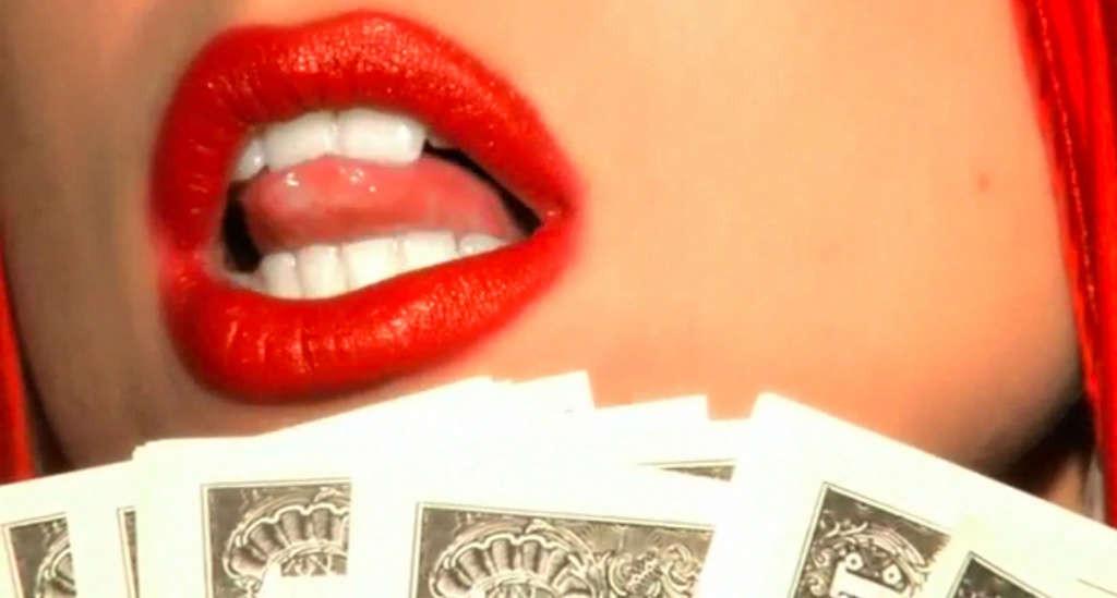 10P Lady Gaga posing very sexy and leggy on bed with money