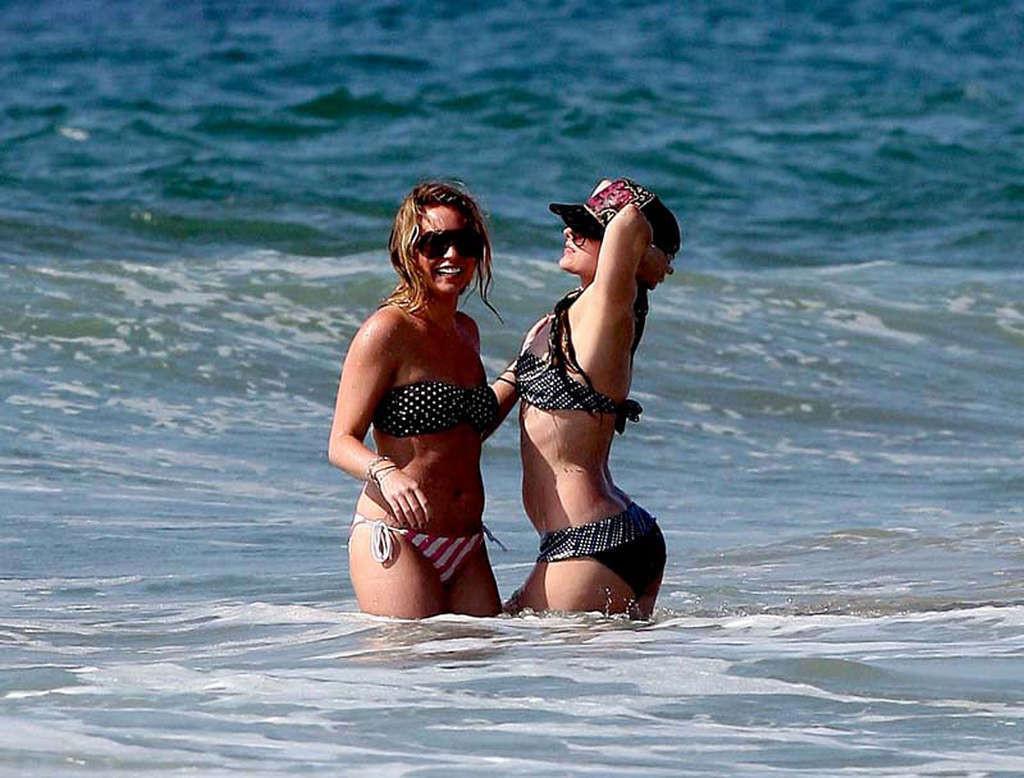 16P Avril Lavigne showing her sexy body and hot ass in bikini on beach