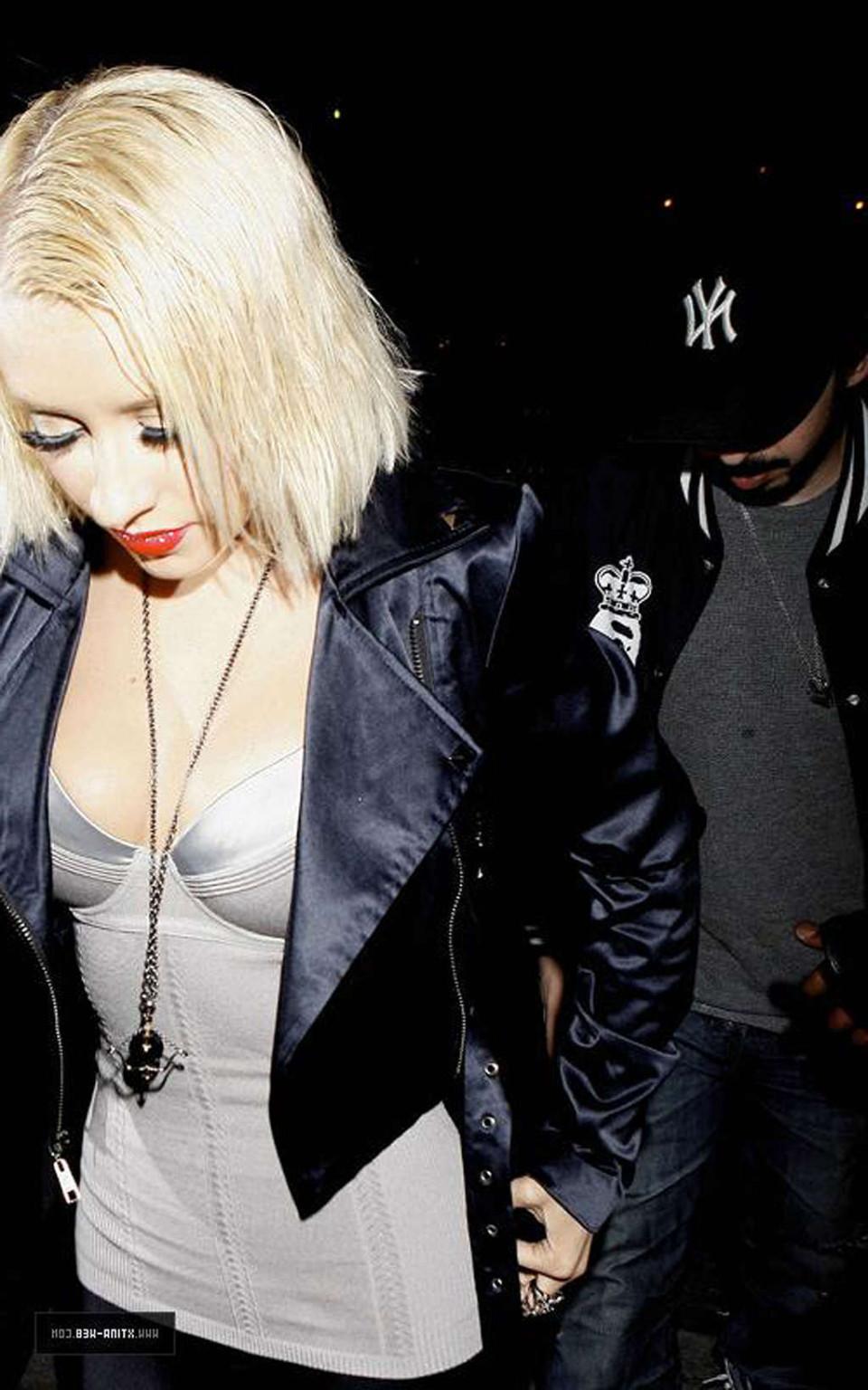10P Christina Aguilera showing her ass in thong and looking sexy in see thru dress