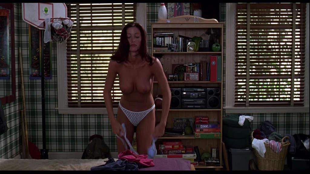 10P Shannon Elizabeth showing her nice big tits on bed and posing sexy