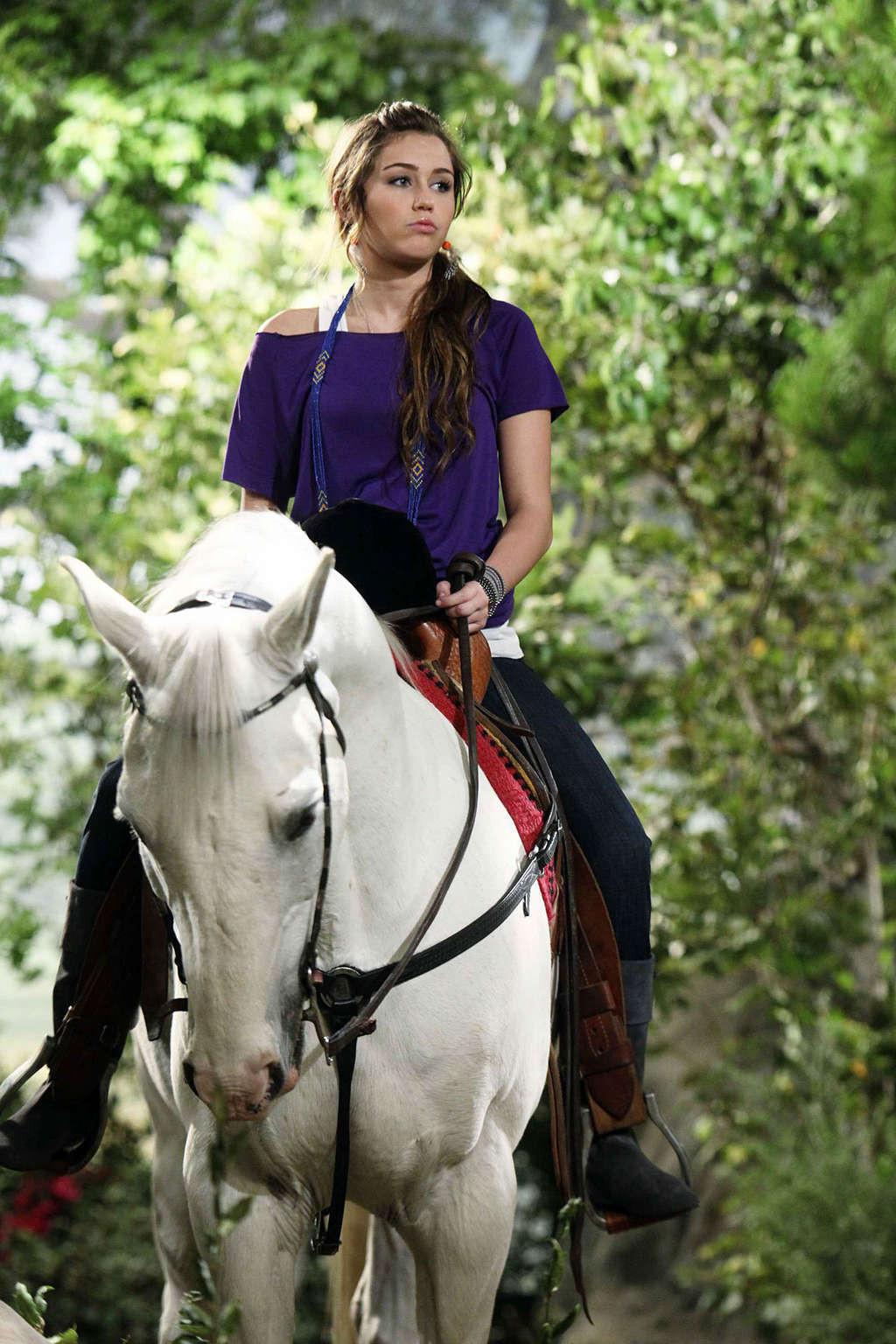 16P Miley Cyrus very sexy and hot photos of young singer with horses