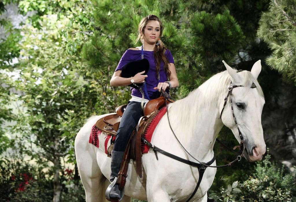 16P Miley Cyrus very sexy and hot photos of young singer with horses