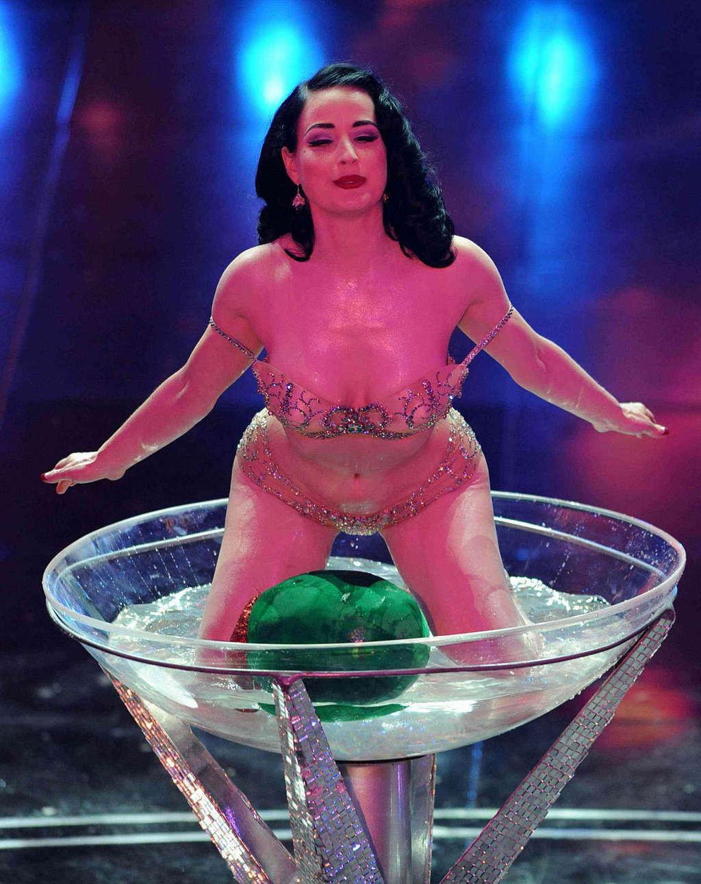 10P Dita Von Teese showing her nice big tits while performing streaptese