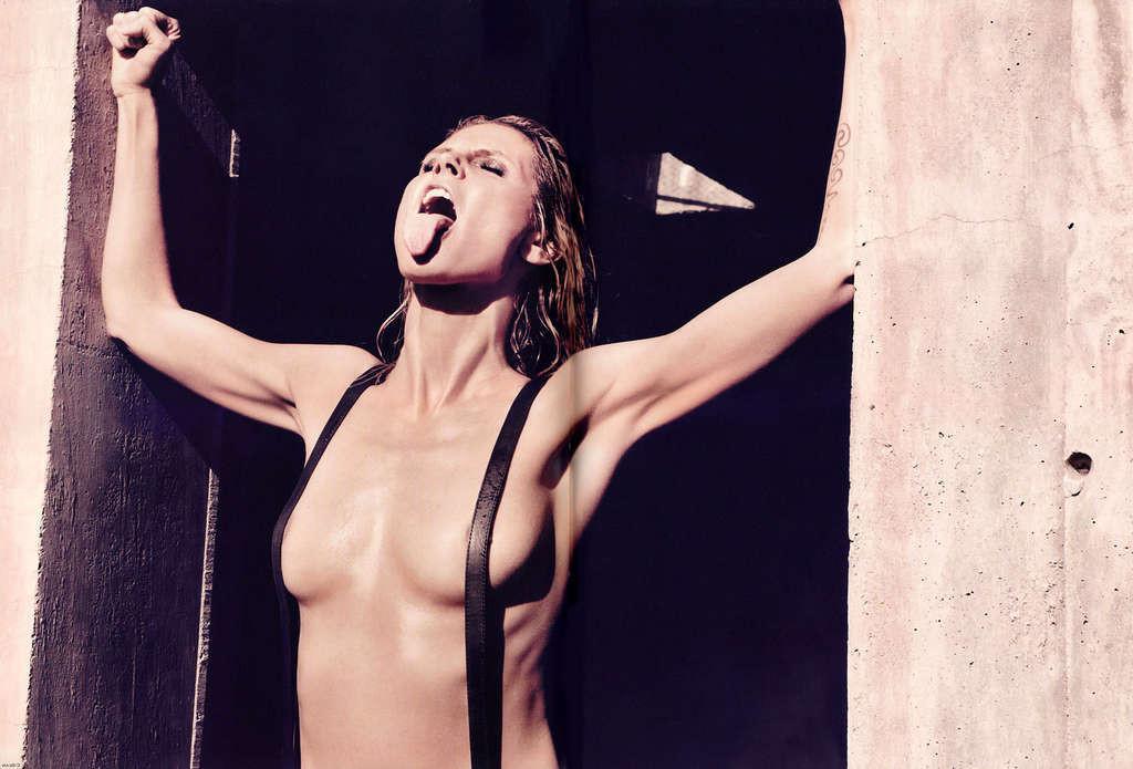 16P Heidi Klum exposing her nice tits and posing topless on bike