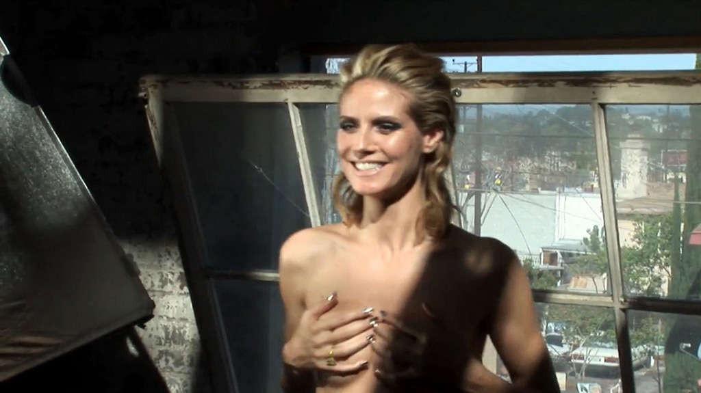 16P Heidi Klum exposing her nice tits and posing topless on bike