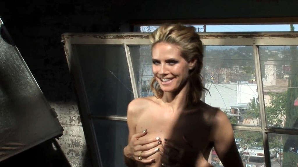 16P Heidi Klum exposing her nice tits and posing topless on bike