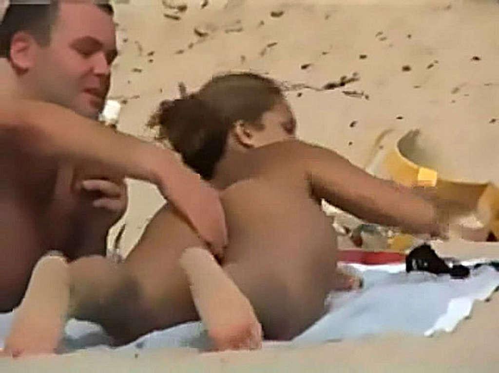 10P Clara Morgane exposing her nice big tits and pussy on beach
