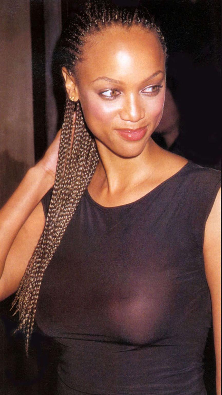 16P Tyra Banks exposing her nice tits in see thru top and posing sexy