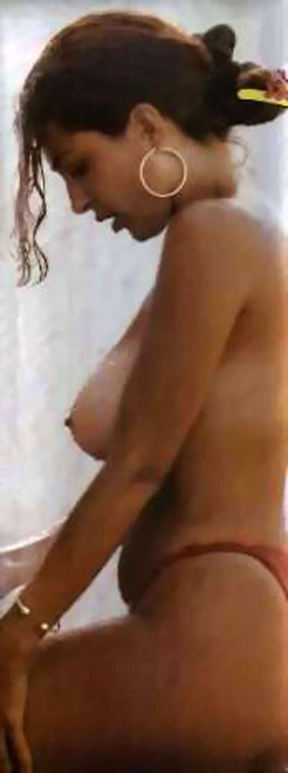 16P Sabrina Ferilli showing sexy ass in thong and extremely huge tits