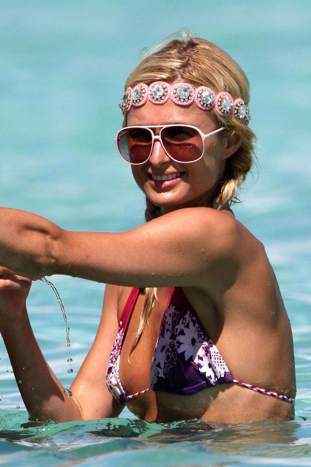 16P Paris Hilton spread her legs and showing sexy underwear in purple skirt