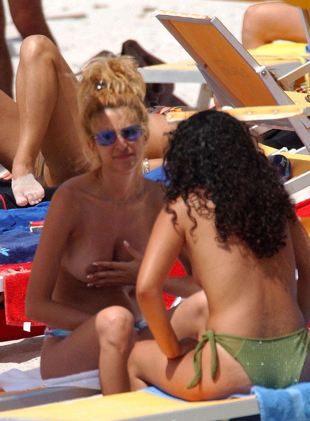 10P Adriana Volpe exposing her nice big tits on beach paparazzi pictures