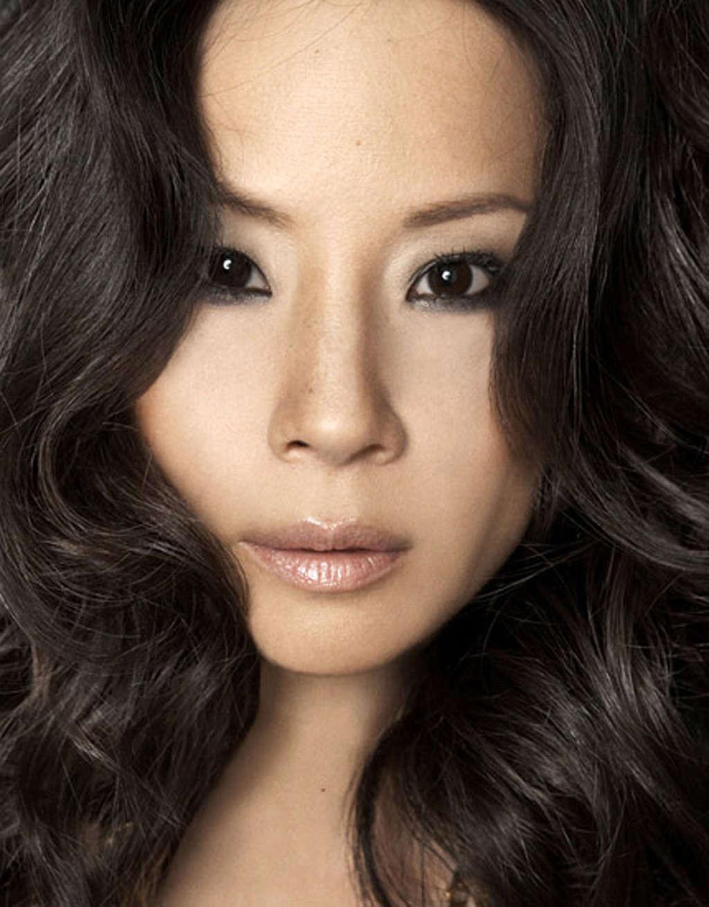 10P Lucy Liu exposing her nice tits and great legs in some photoshoot