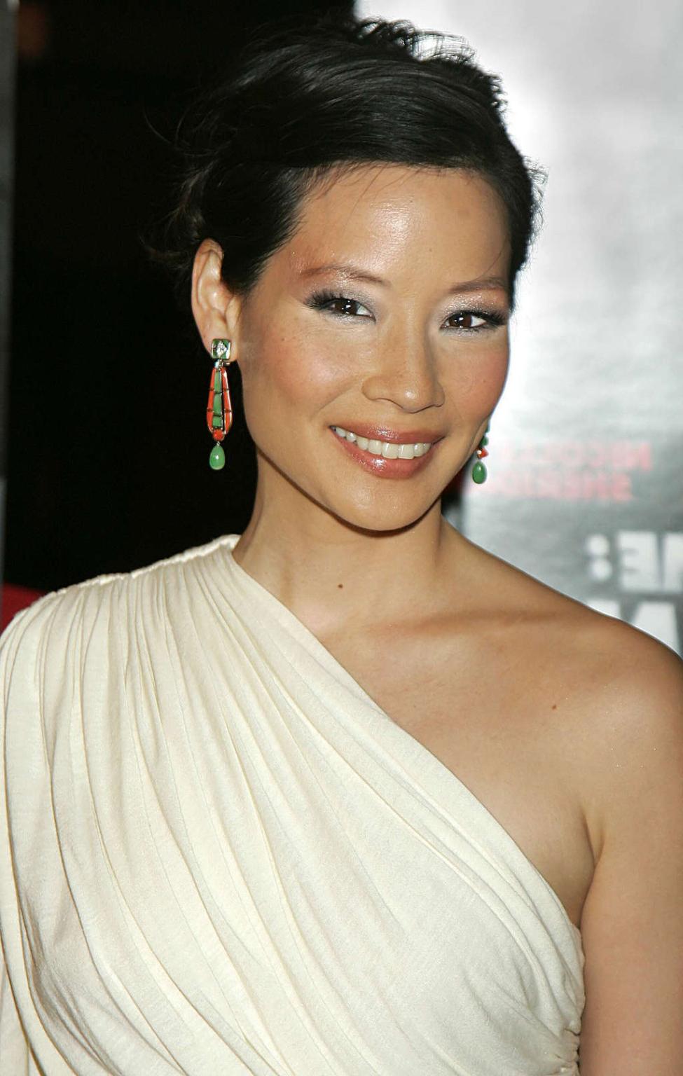 10P Lucy Liu exposing her nice tits and great legs in some photoshoot
