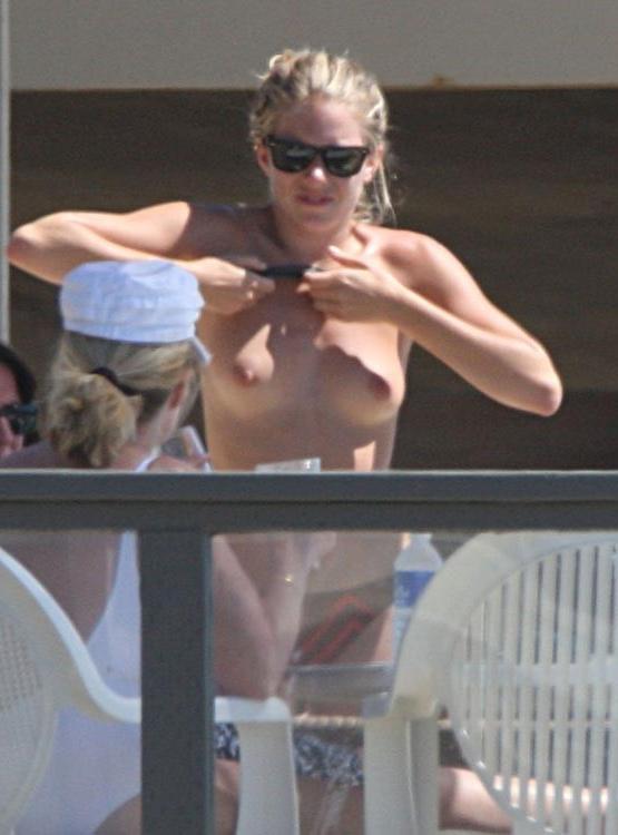 15P Sienna Miller in bikini and sunbathing topless