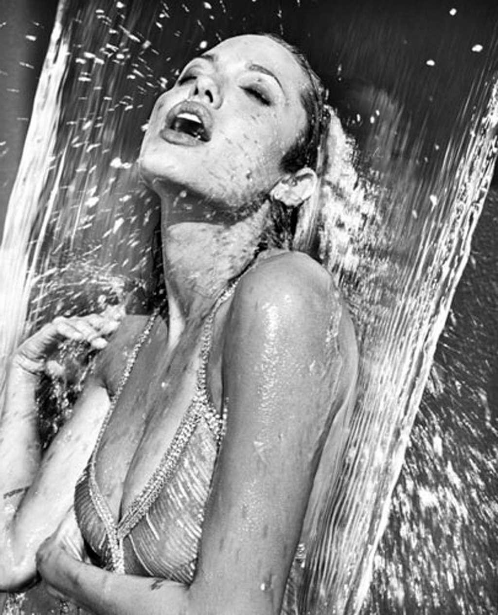 10P Angelina Jolie exposing her nice body in see thru dress