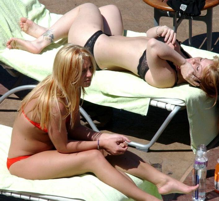 15P sexy pop star Britney Spears stretching in a red thong bikini