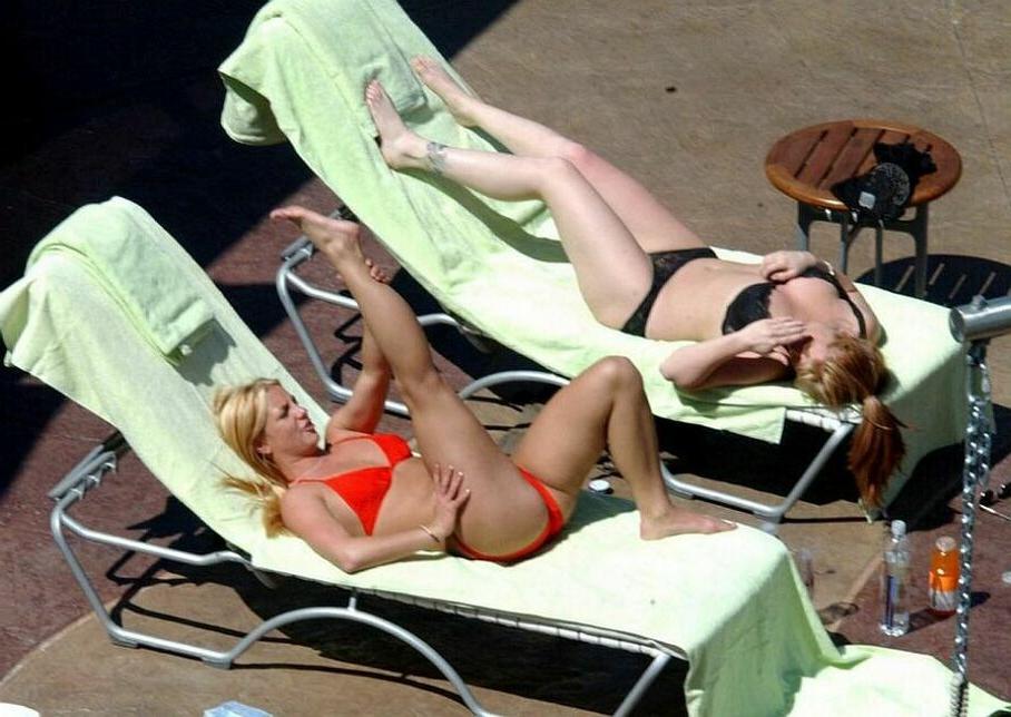 15P sexy pop star Britney Spears stretching in a red thong bikini