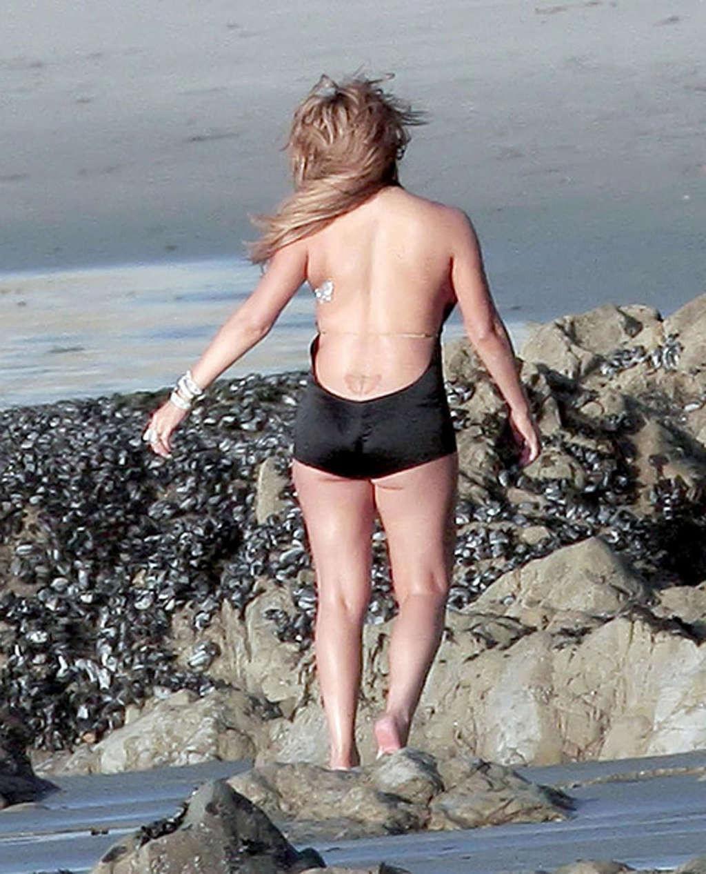 16P Mariah Carey looking sexy in bikini and showing big tits