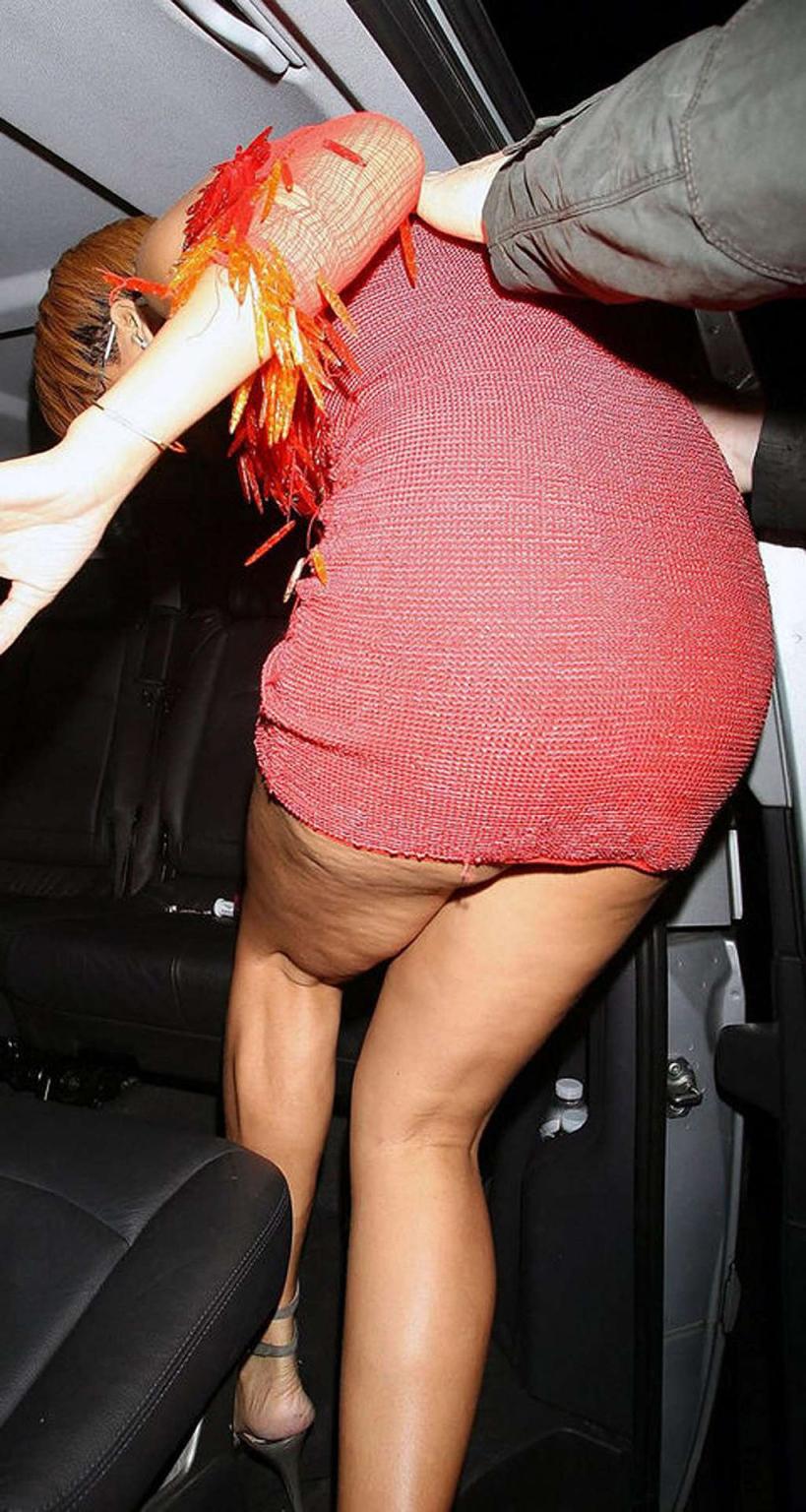 16P Rihanna enjoying on pool and showing her sexy tits and ass in evening skirt