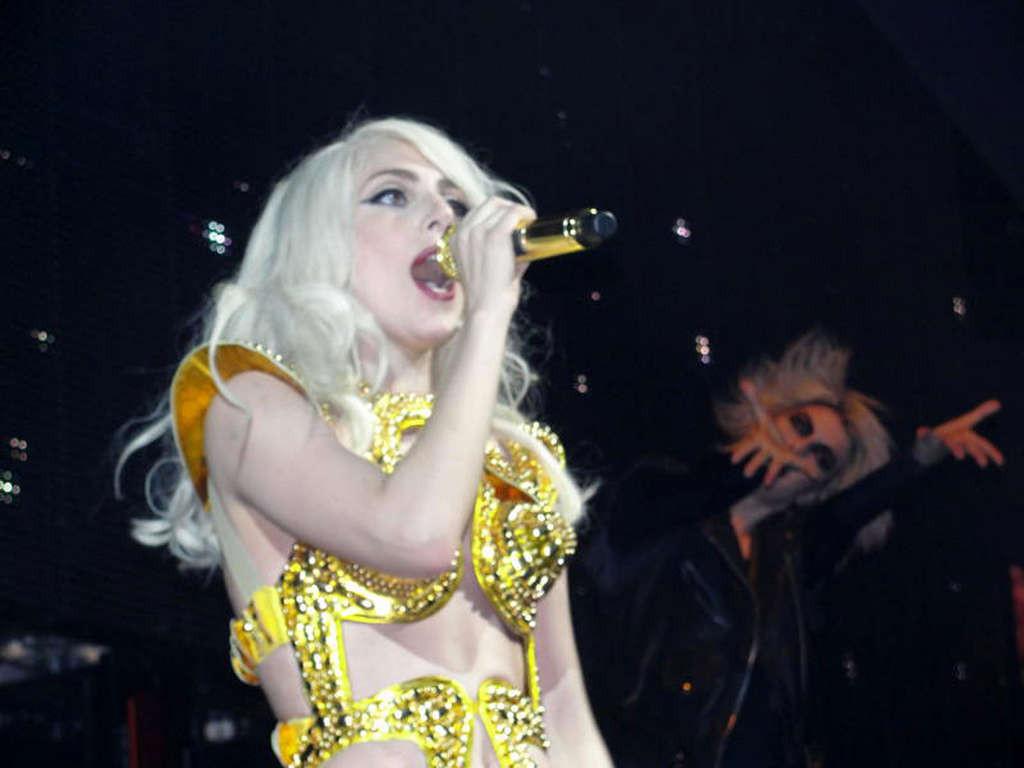 16P Lady Gaga in ripped fishnet stockings flashing her panties in public