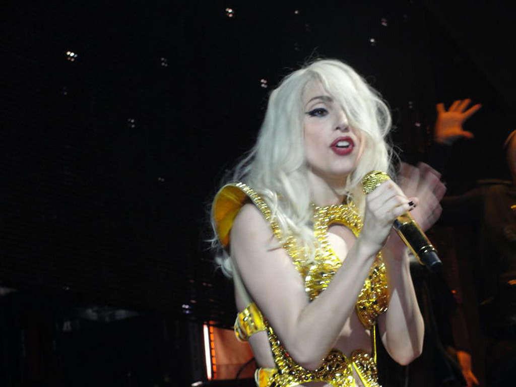 16P Lady Gaga in ripped fishnet stockings flashing her panties in public