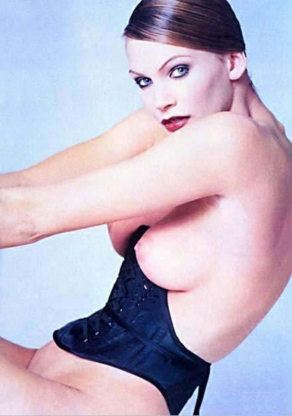 16P Natasha Henstridge exposing her nice big tits and posing in bikini