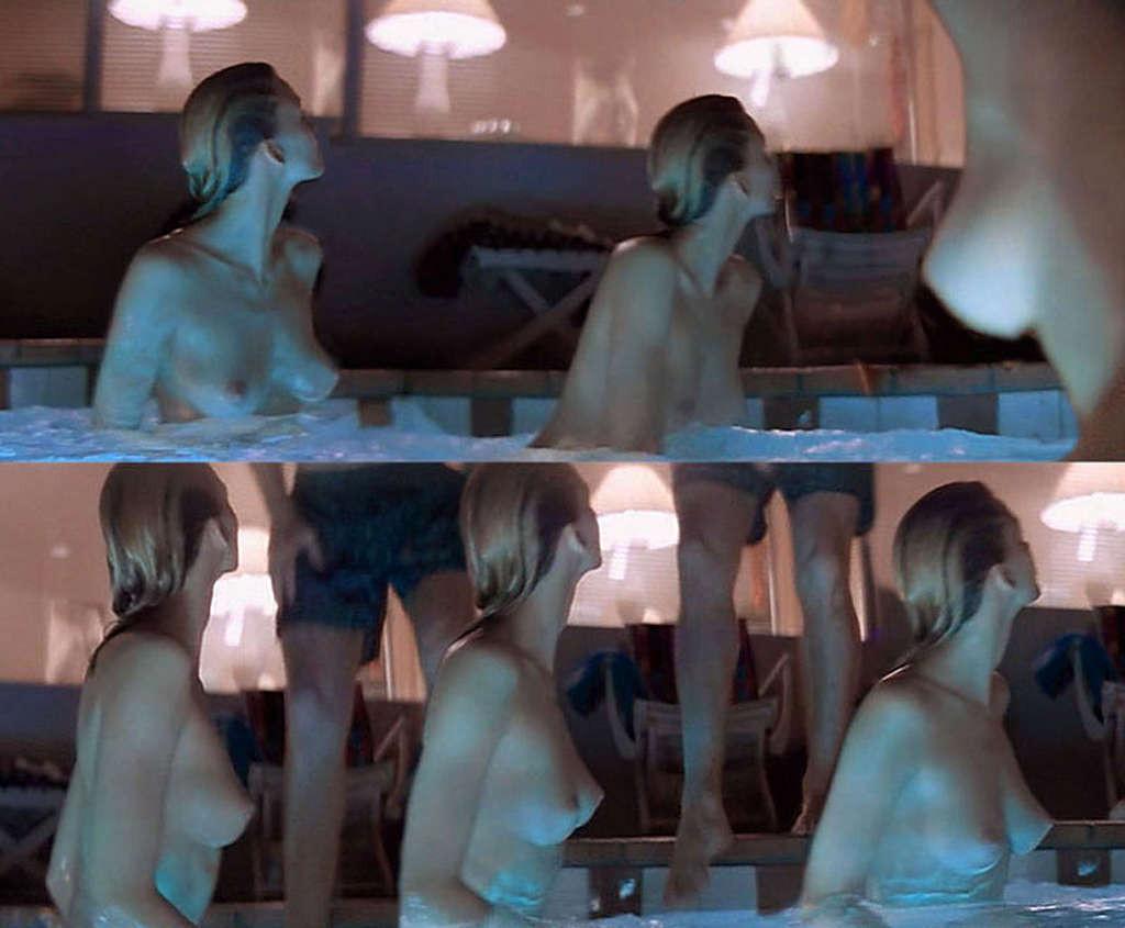 16P Natasha Henstridge exposing her nice big tits and posing in bikini