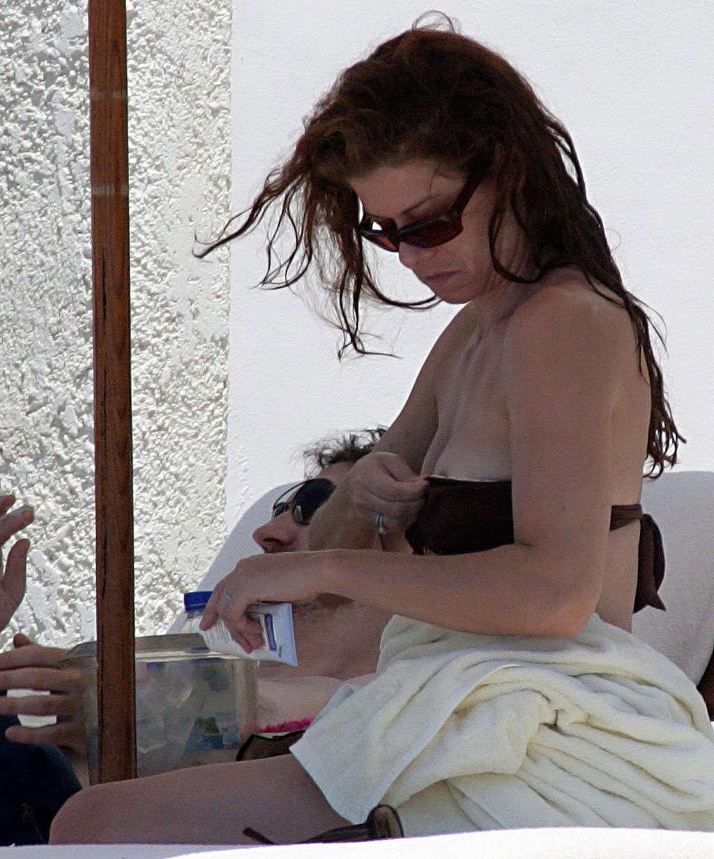 16P Debra Messing nipple slip on beach paparazzi pictures and posing nude