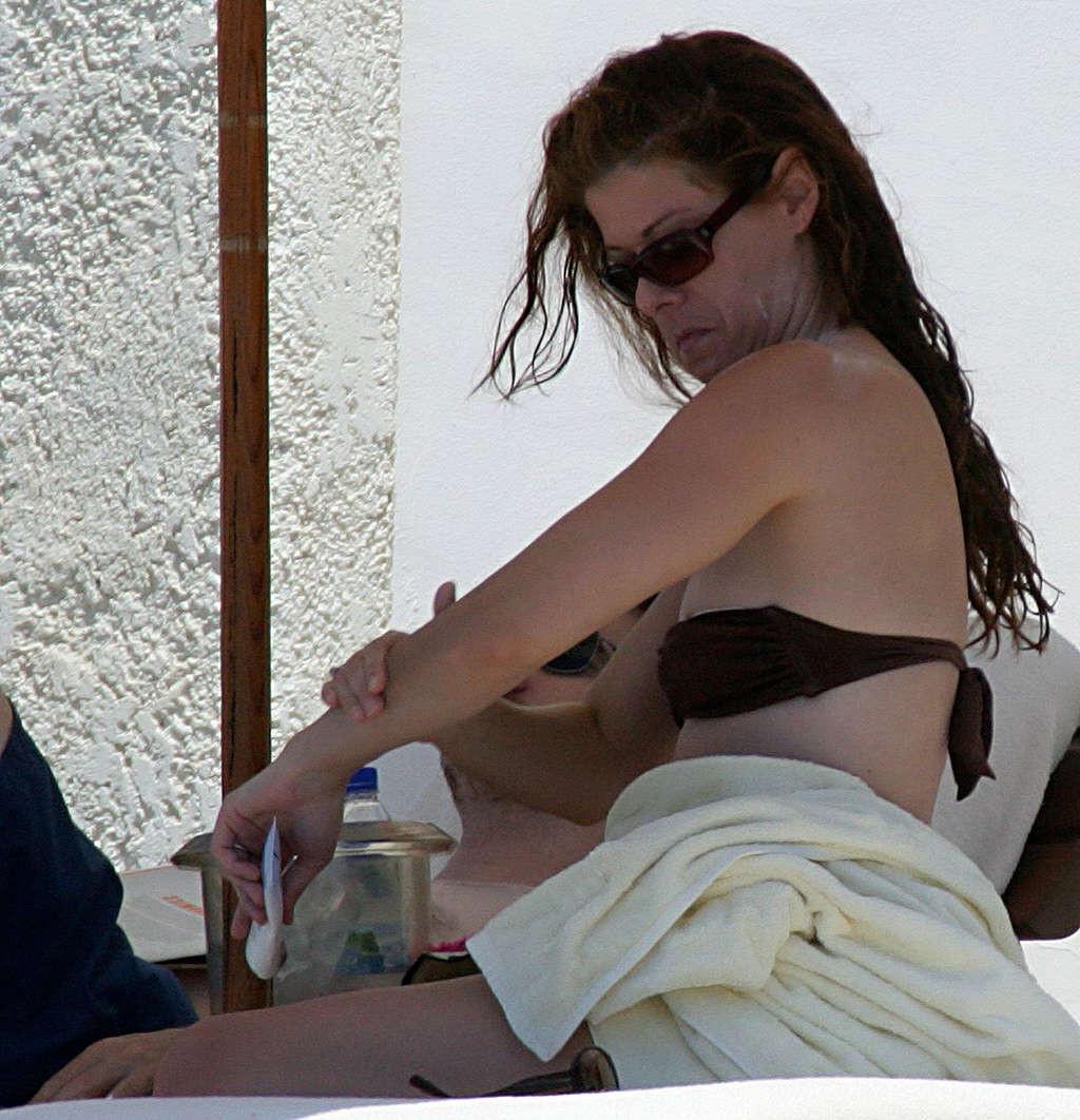 16P Debra Messing nipple slip on beach paparazzi pictures and posing nude